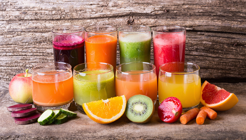 Healthy fruit & vegetable juice on wooden background